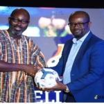 Senior Manager for Marketing Planning and Analytics, Guido Sopiimeh, receiving the autographed football from Kurt Okraku, on behalf of the Chief Commercial Officer of MTN