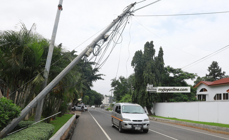 Telecommunication utility poles believed to be owned by Telecel a leading telecommunications company in Ghana are dangerous  bent across a busy road on Nortei Ababio Street near Healthnet Airport Medical Centre in Airport residential area.