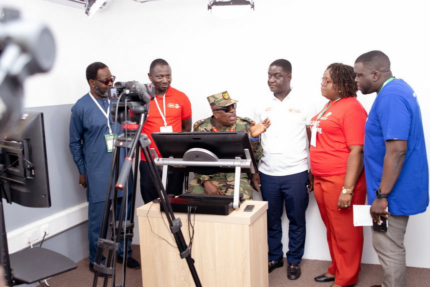 Major General Gyane (seated) being briefed about KNUST's E-learning infrastructure when he visited the E-Learning Centre at the University. With him are Prof Eric Appau Asante (3rd right) and Prof Isaac Dontwi (left), Board Chairman of the KNUST E-Learning Centre.