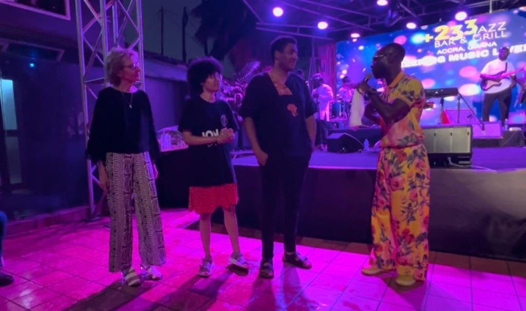 Okyeame Kwame (right) with Jon K’s widow and children at the concert