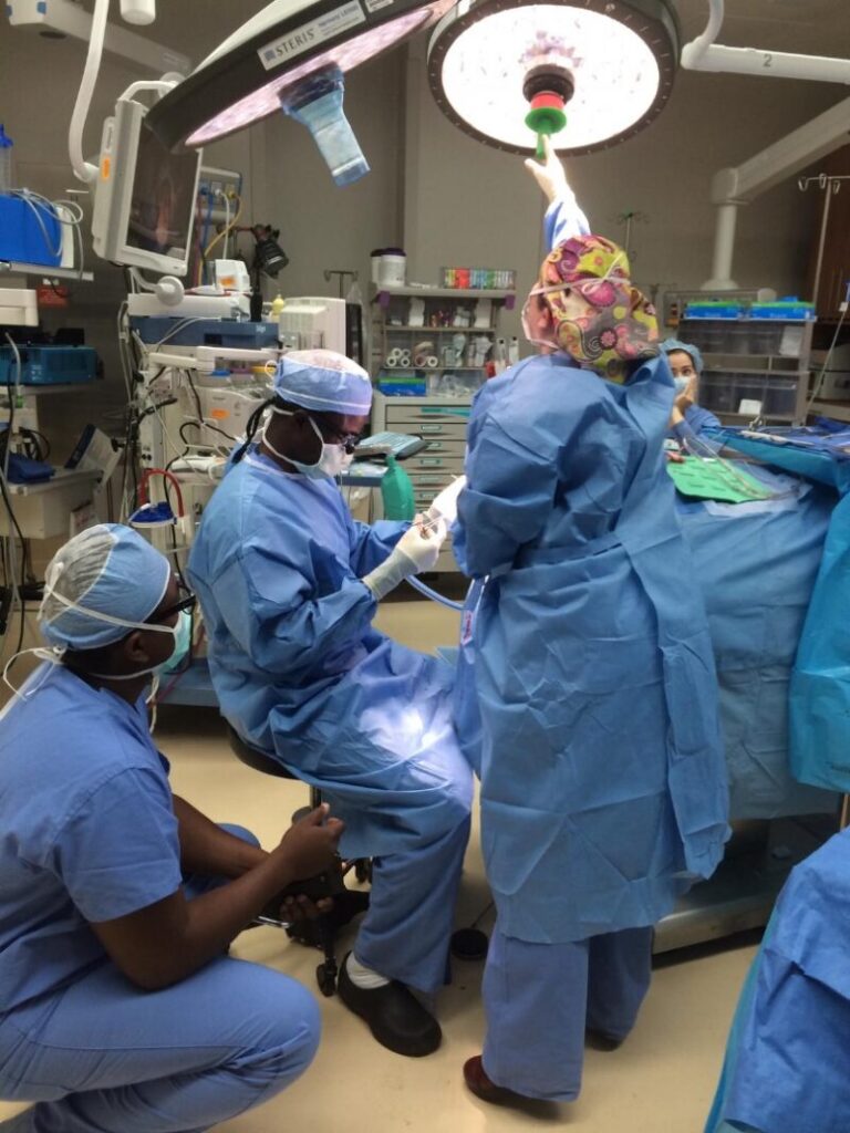 Dr. Solomon Obiri-Yeboah and colleagues at work. Kneeling is Dr Frank Boakye, the neurosurgeon who trained with and works with Dr. Obiri-Yeboah at the Komfo Anokye Teaching  Hospital