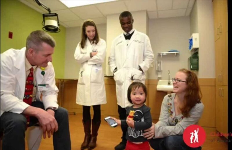 From left to right: Dr John H Grant, ( Dr. Obiri-Yeboah's trainer and supervisor), one of his residents, the patient, and mother.